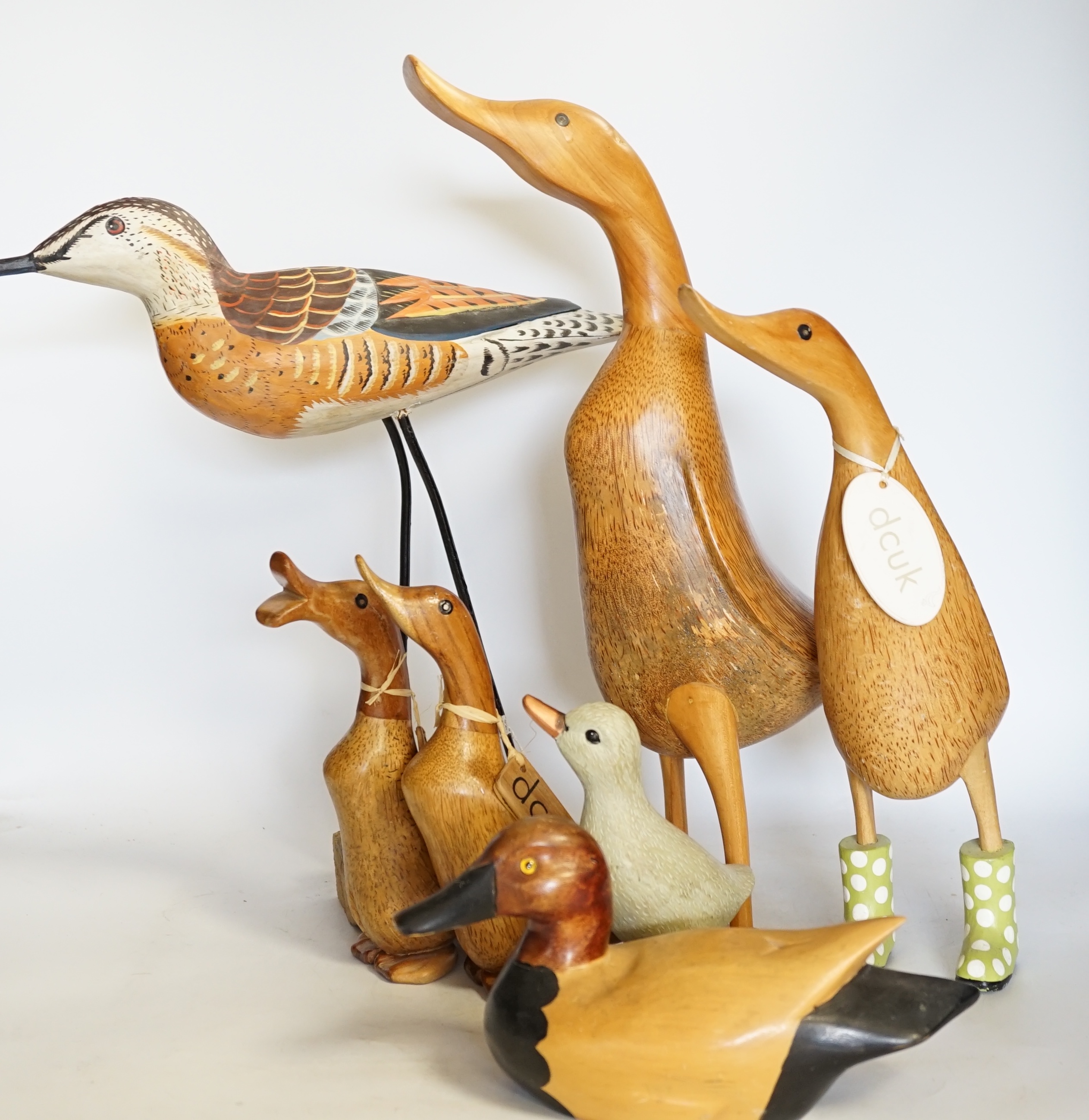 A collection of wooden painted ducks and waders